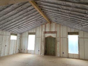 Inside of a interior remodel, featuring full foam insulation on the walls and ceiling.
